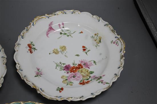 A Chelsea gold anchor bird and insect plate and a similar pair of floral plates, c. 1765, 22 and 23cm